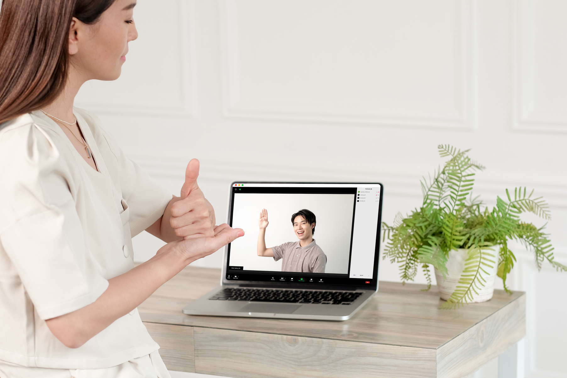 Man and Woman Communicating in Sign Language Via Zoom Call
